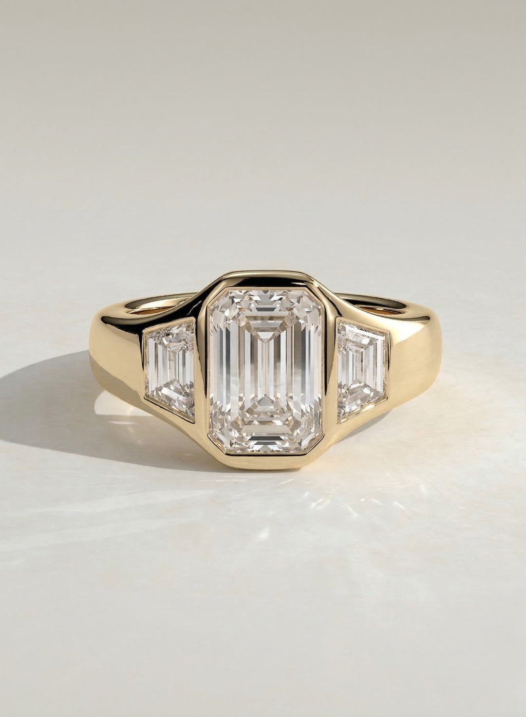 The Maren Ring - Emerald Three Stone Bezel Ring