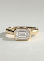 The Alina Ring - East-West Emerald Bezel Solitaire Ring