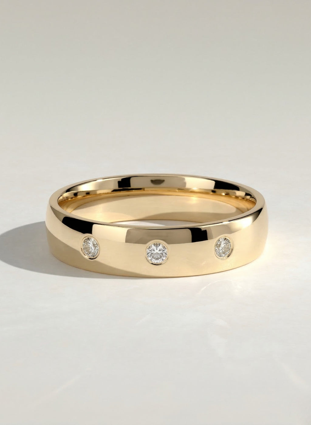 The Lucas Band - Three Stone Bezel Diamond Band