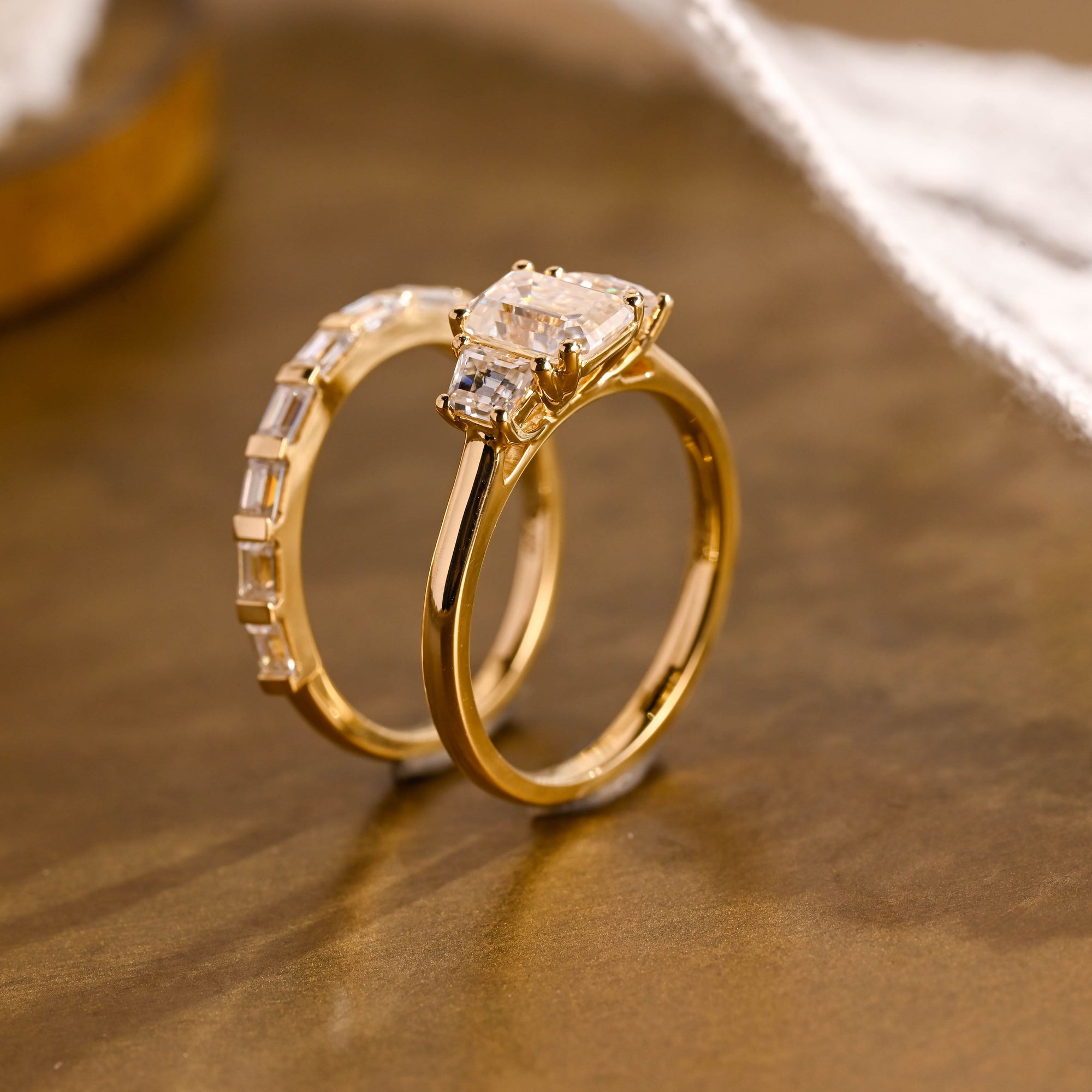 The Astoria Bridal Set - Emerald Cut Three Stone Ring with Baguette Band