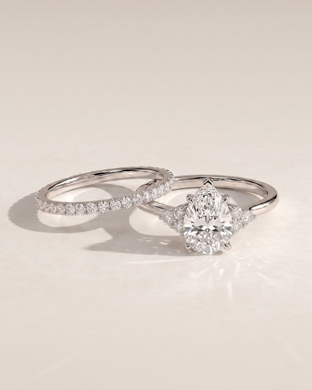 The Eliana Bridal Set - Pear Three Stone Ring with Pavé Wedding Band