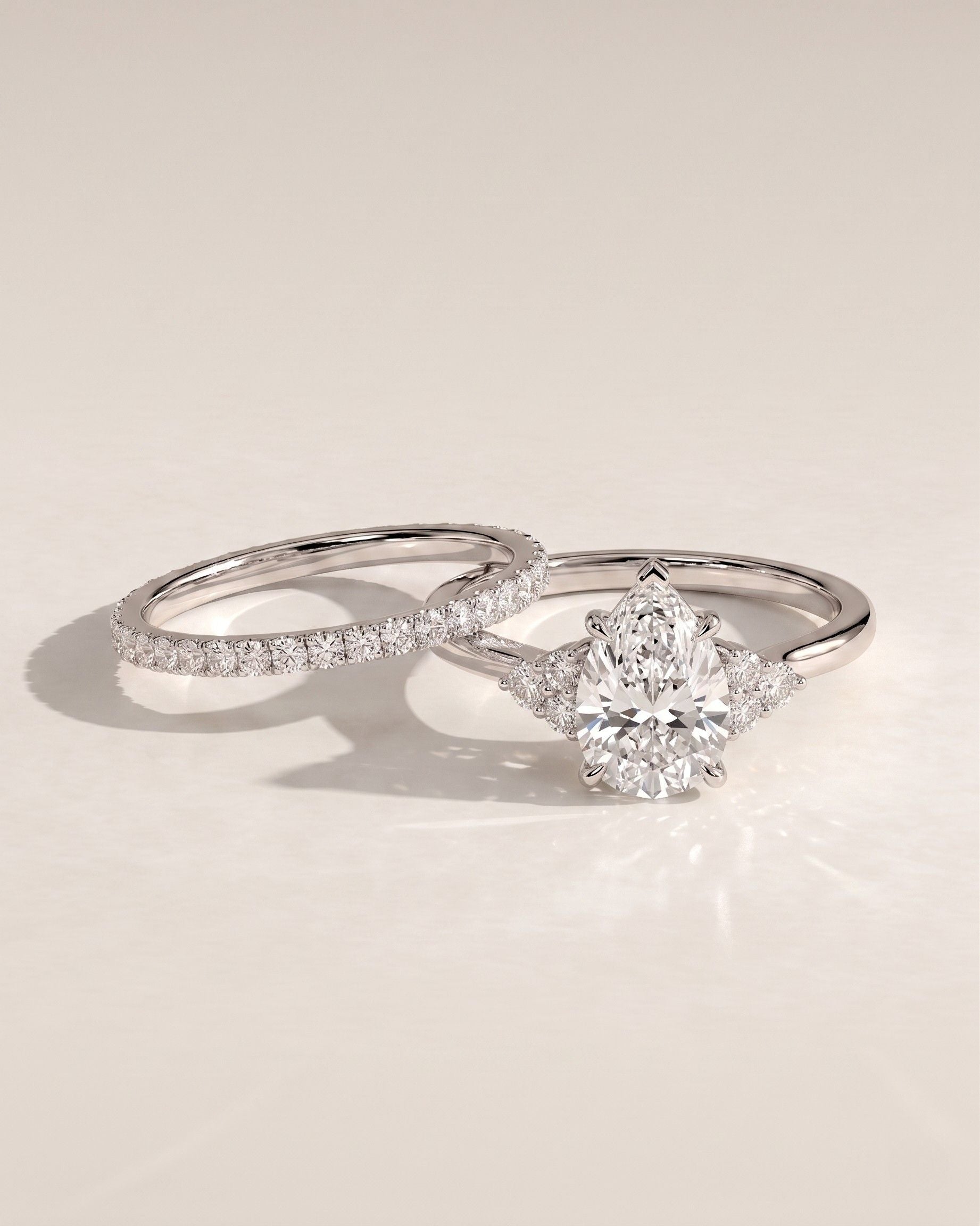 The Eliana Bridal Set - Pear Three Stone Ring with Pavé Wedding Band