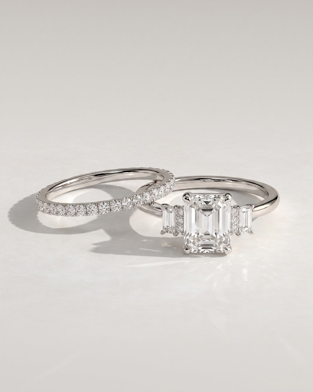 The Geneva Bridal Set - Emerald Cut Three Stone Ring with Pavé Wedding Band