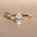 The Nyra Ring – Oval Three Stone Ring with Pear Side Stones