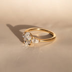 The Nyra Ring – Oval Three Stone Ring with Pear Side Stones