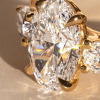 The Nyra Ring – Oval Three Stone Ring with Pear Side Stones