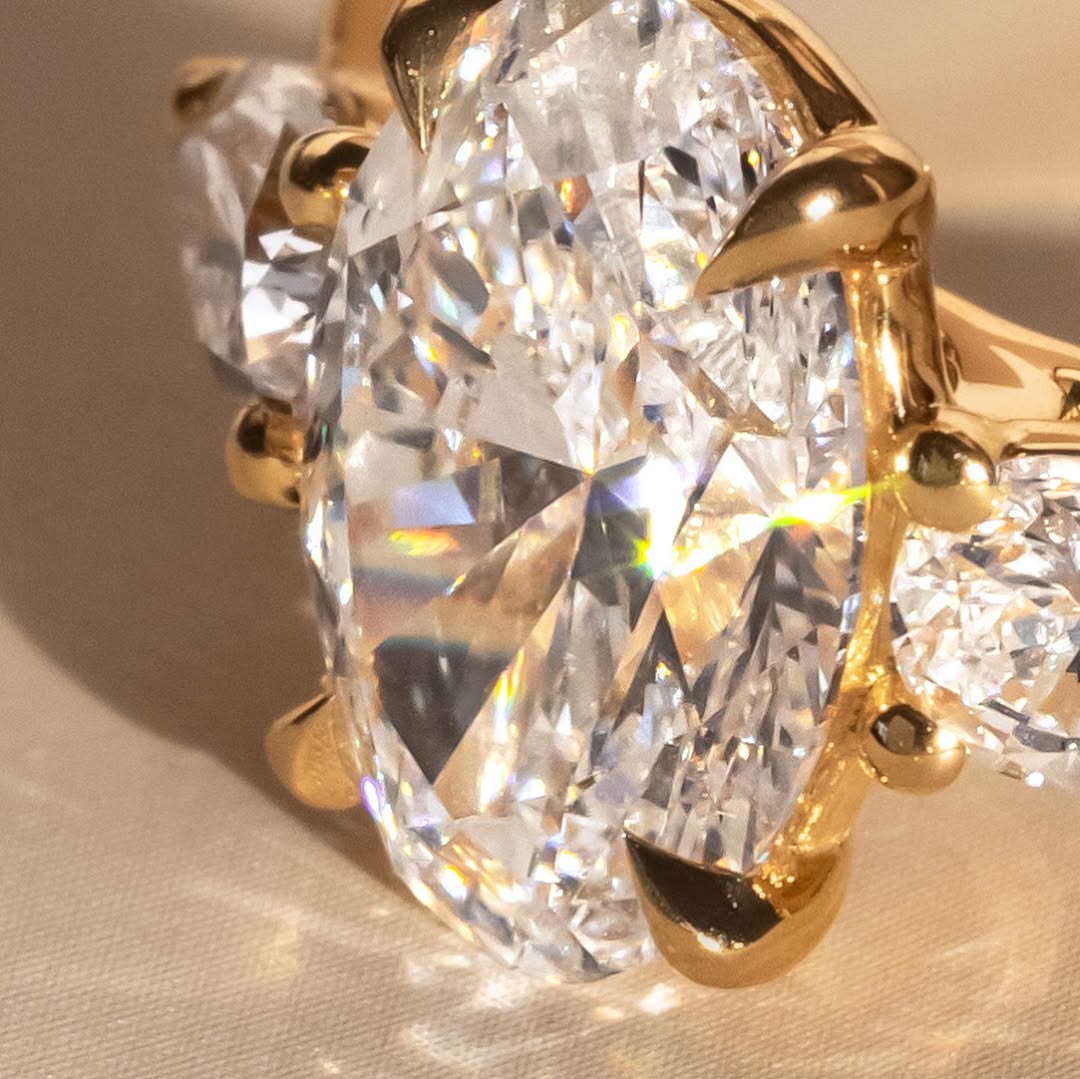 The Nyra Ring – Oval Three Stone Ring with Pear Side Stones