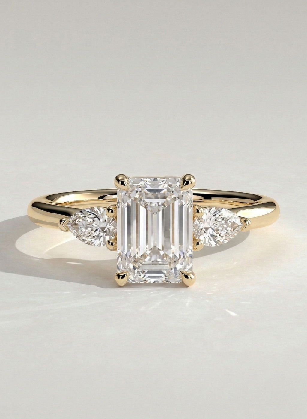 The Trinity Ring - Emerald & Pear Three Stone Diamond Ring