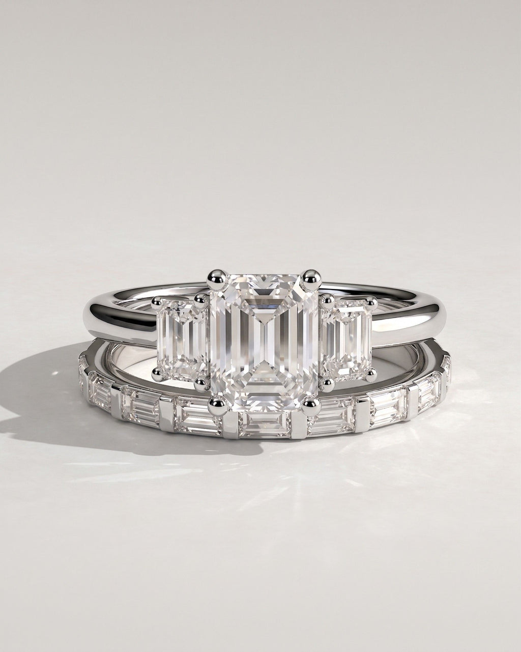 The Astoria Bridal Set - Emerald Cut Three Stone Ring with Baguette Band