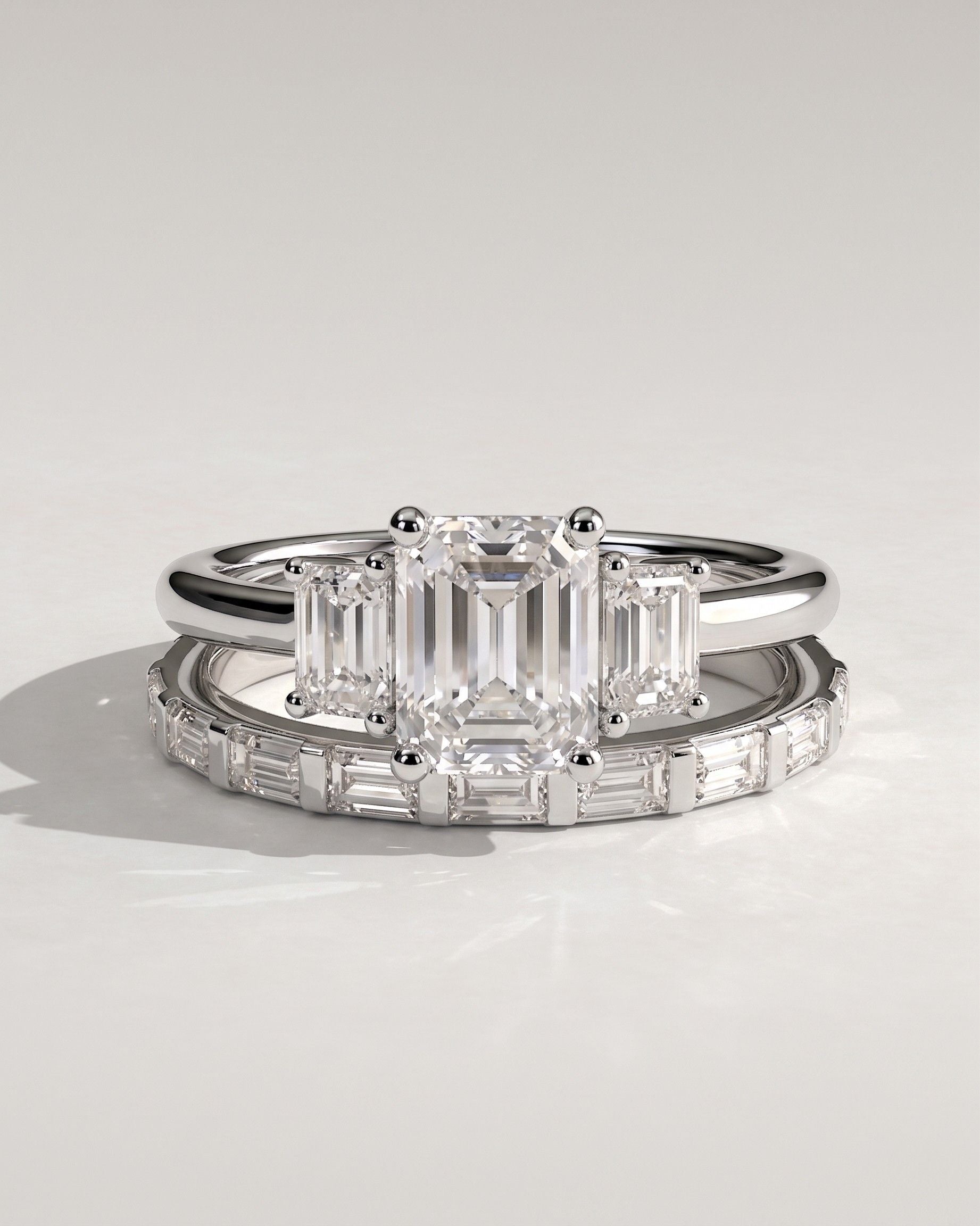 The Astoria Bridal Set - Emerald Cut Three Stone Ring with Baguette Band