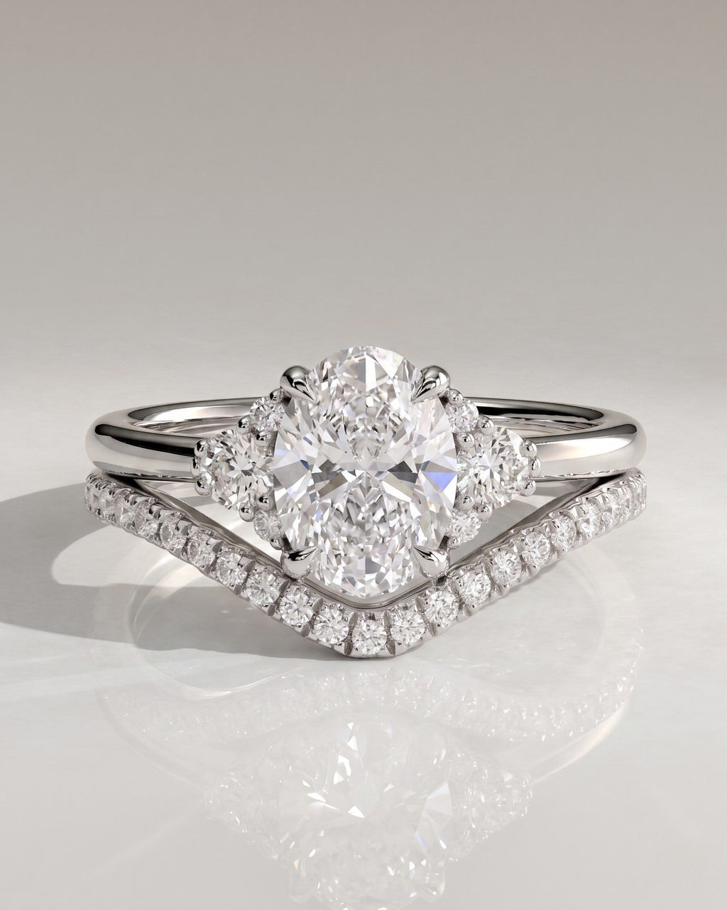 The Evelina Bridal Set - Oval Three Stone Diamond Ring with Contour Band
