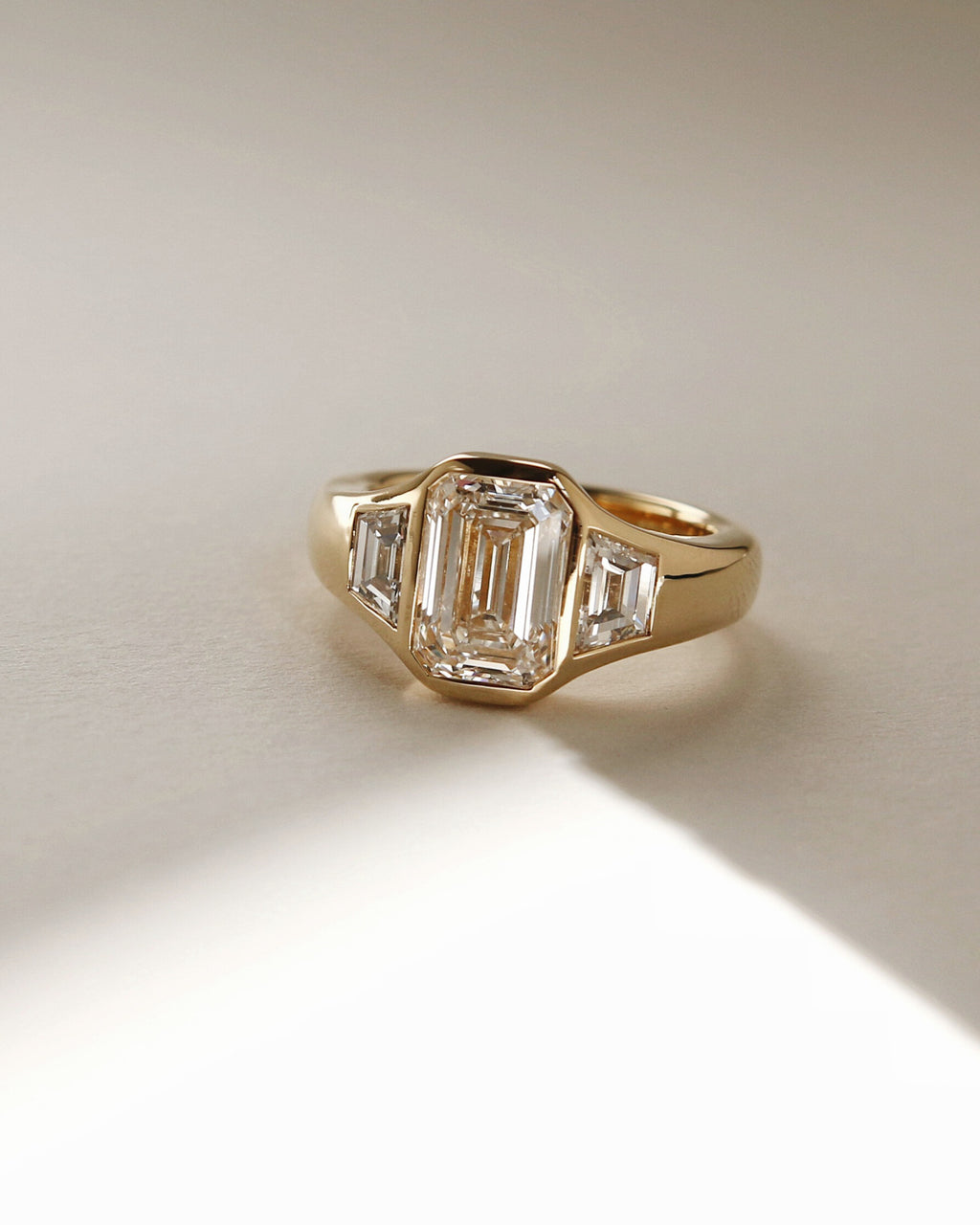 The Maren Ring - Emerald Three Stone Bezel Ring