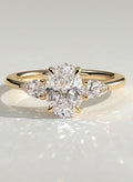 The Nyra Ring – Oval Three Stone Ring with Pear Side Stones