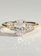 The Nyra Ring – Oval Three Stone Ring with Pear Side Stones