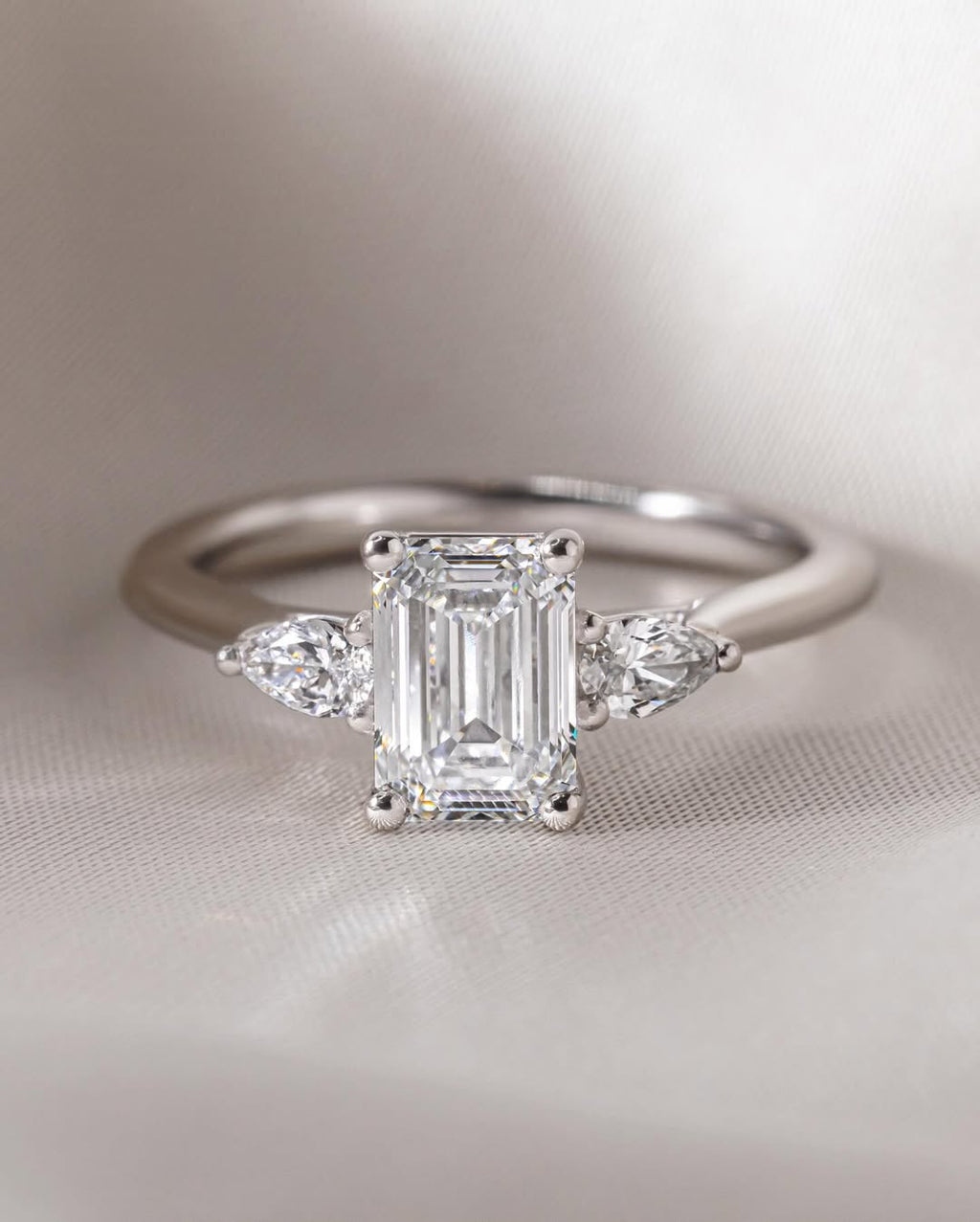 The Trinity Ring - Emerald & Pear Three Stone Diamond Ring